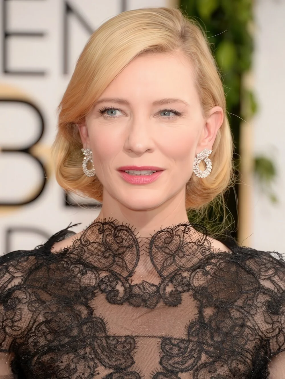 Polished blonde faux bob with a tucked side.