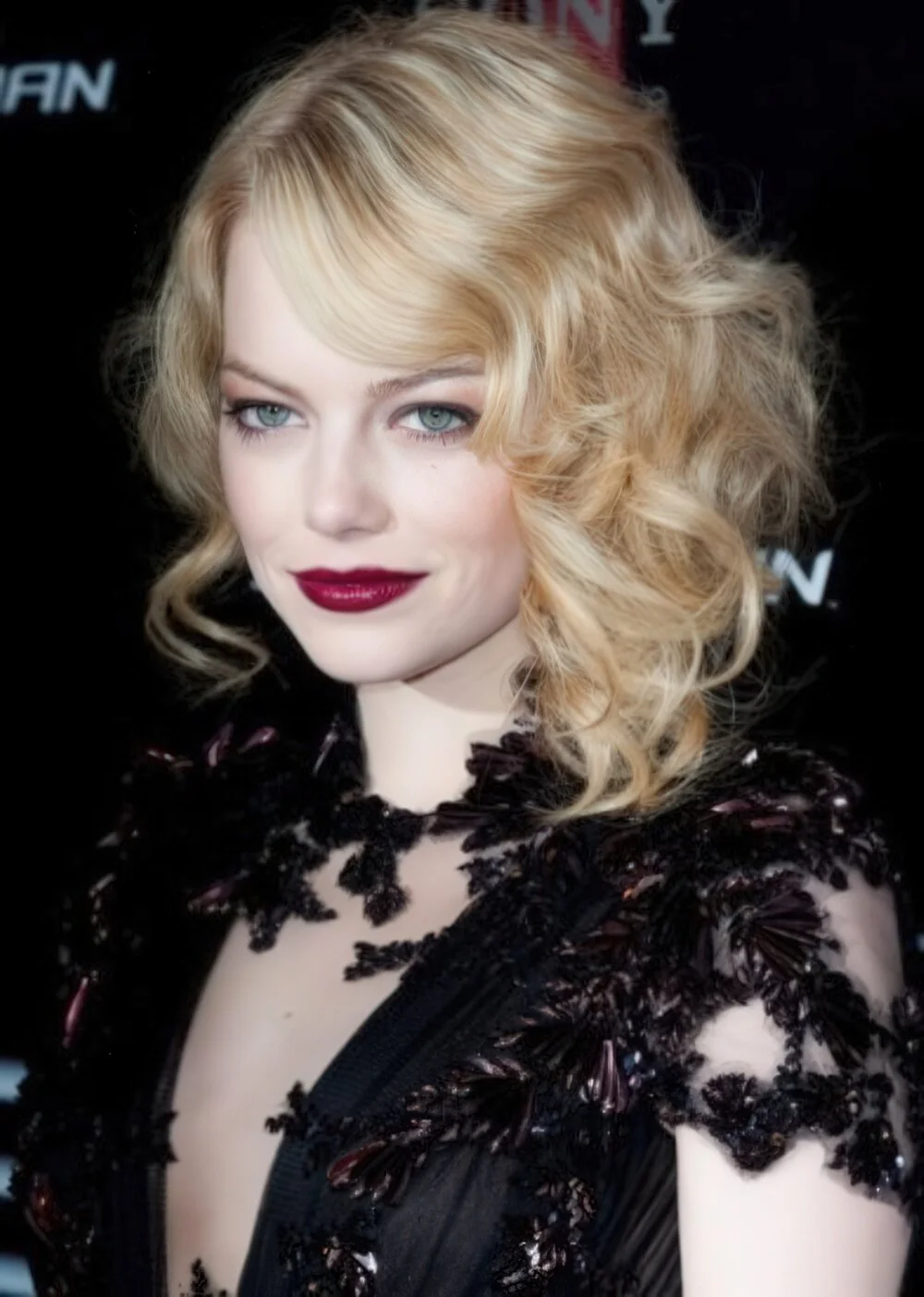 Voluminous blonde faux bob with vintage curls.