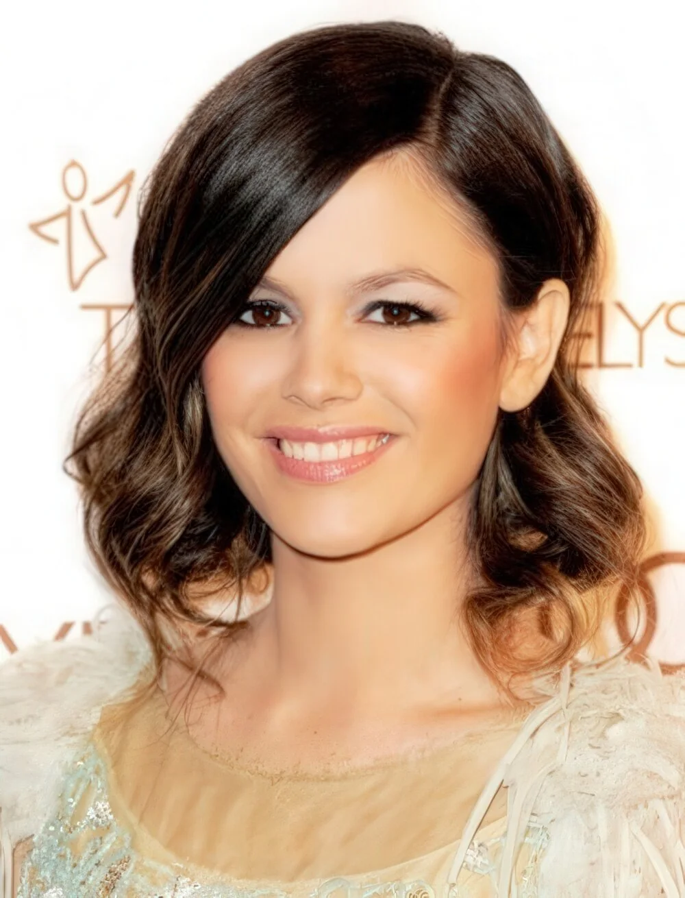 Glossy brunette faux bob with loose waves.