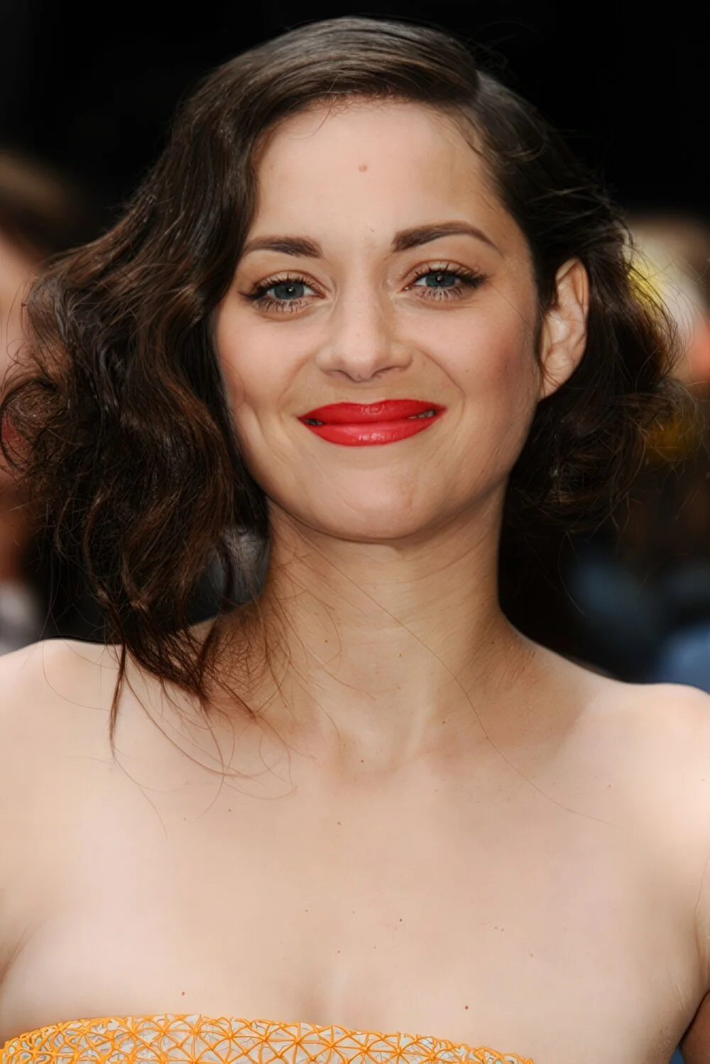 Tousled dark faux bob with a center part.