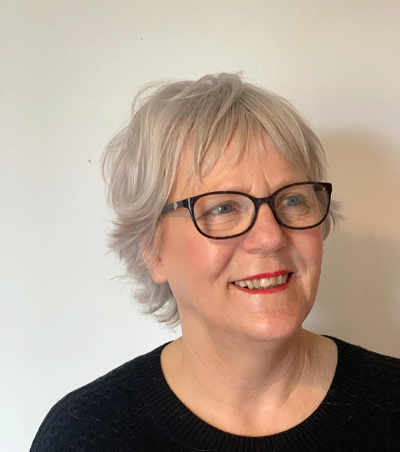 ear straight gray pixie with wispy fringe shown as a thin hairstyles for older women idea