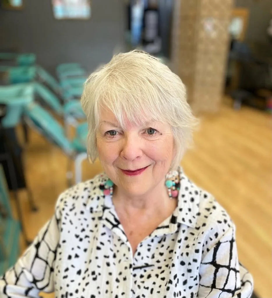 ear straight blonde pixie with wispy fringe shown as a thin hairstyles for older women idea