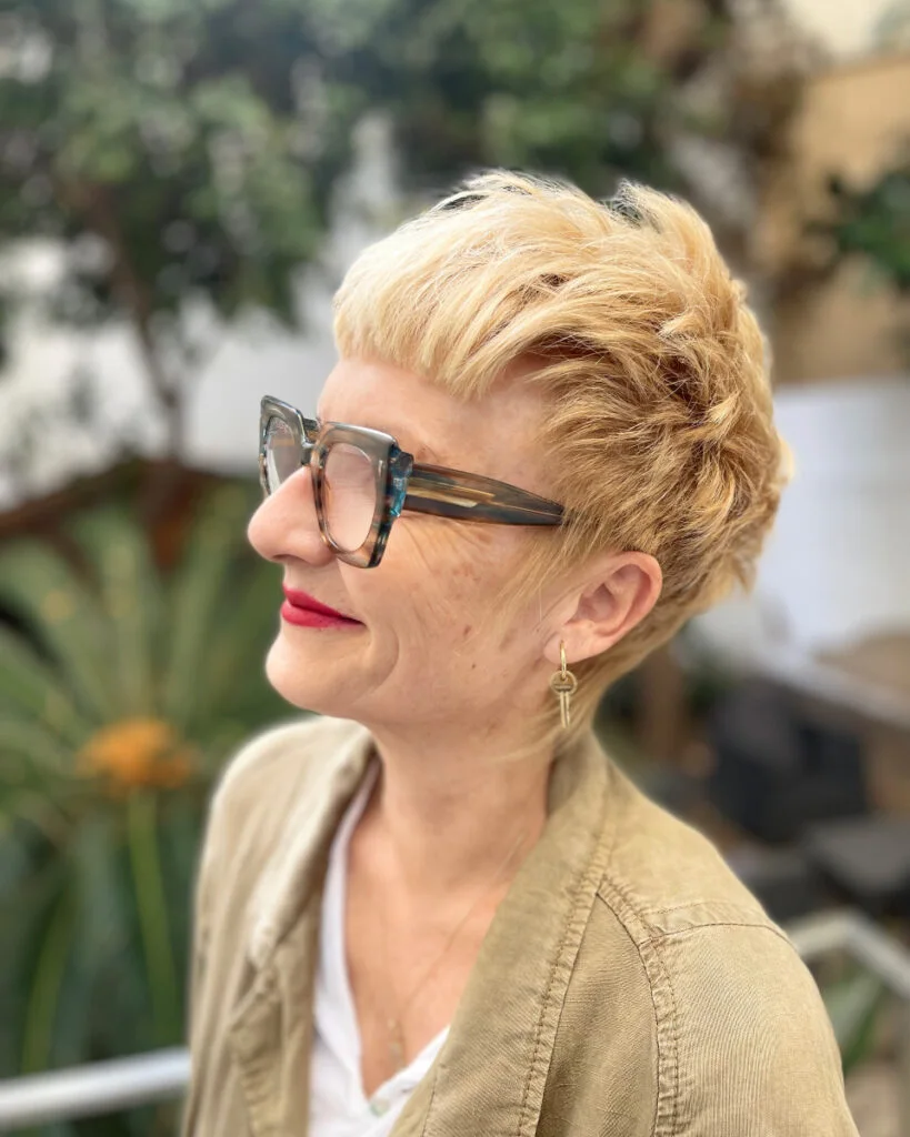 ear straight blonde pixie with side swept fringe shown as a thin hairstyles for older women idea