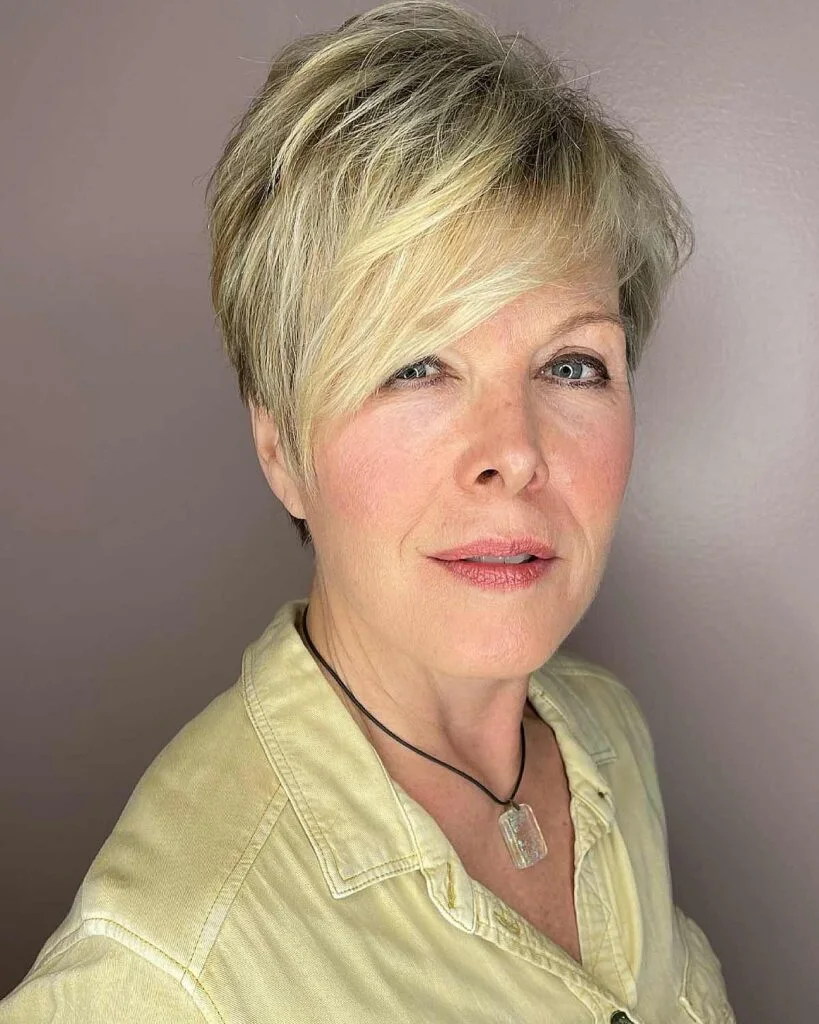 ear straight golden pixie with wispy fringe shown as a thin hairstyles for older women idea, featuring straight texture