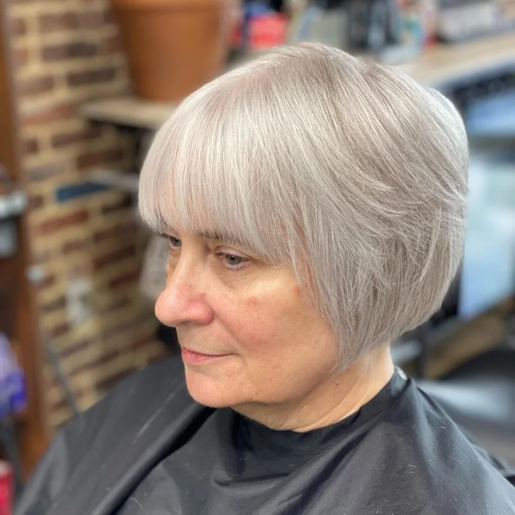 ear wavy chestnut bob shown as a thin hairstyles for older women idea, featuring ear outline
