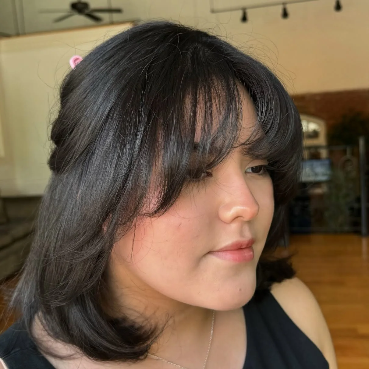 medium straight black layers with curtain fringe shown as a thin hairstyles round face idea
