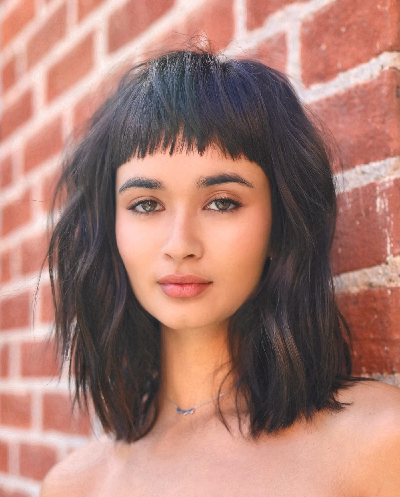 bob straight black bob with micro fringe shown as a thin hairstyles round face idea