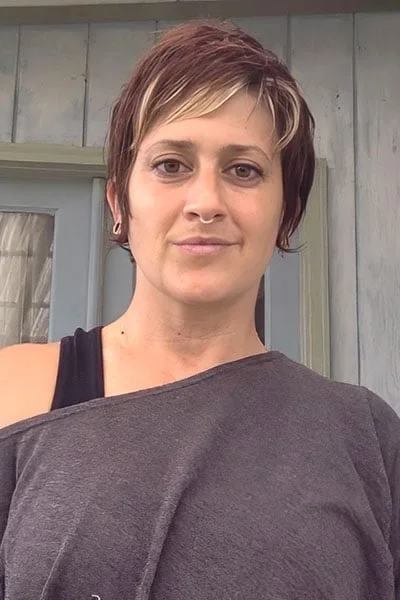 ear straight golden pixie with wispy fringe shown as a thin hairstyles with bangs idea, featuring side part, shown in short side-bang pixie