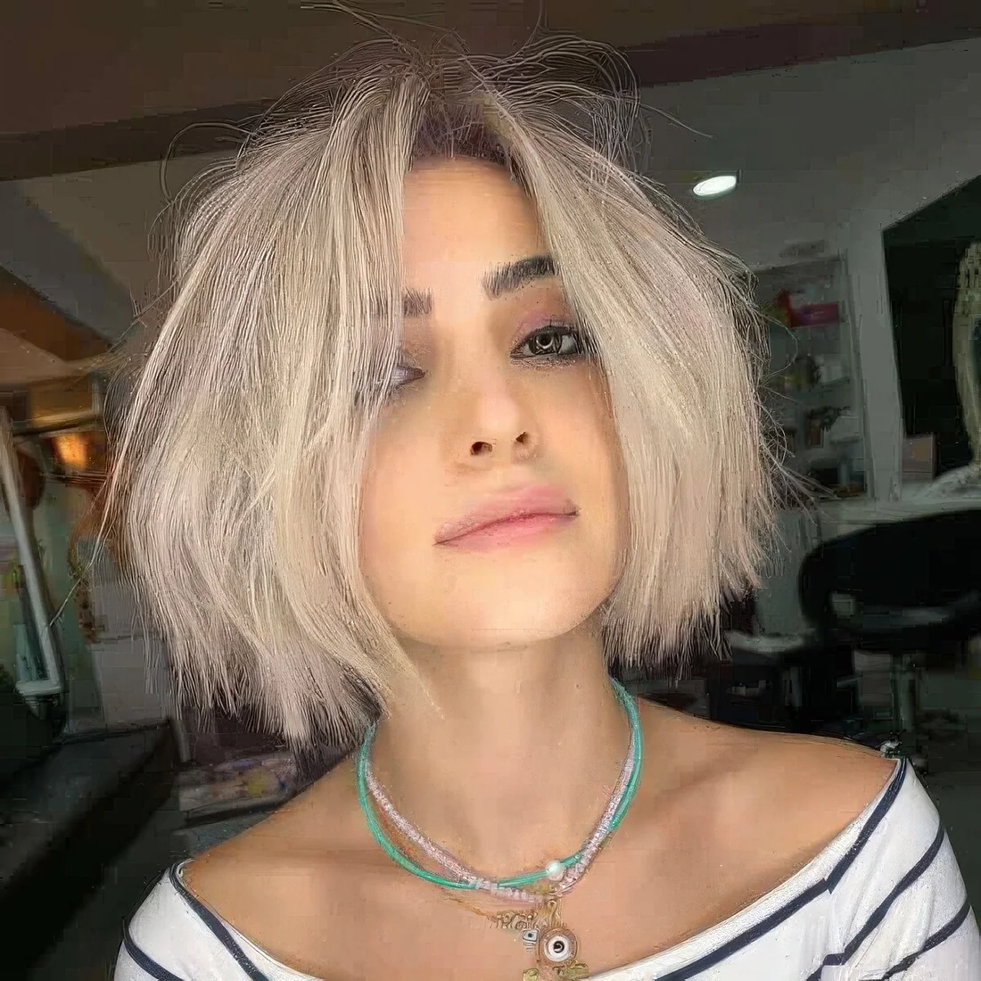 Chin-length blunt bob with a lot of texture and some volume.