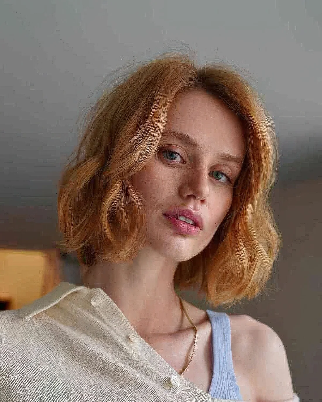 Photo showing light ginger blunt bob, with the hairstyle clearly visible.