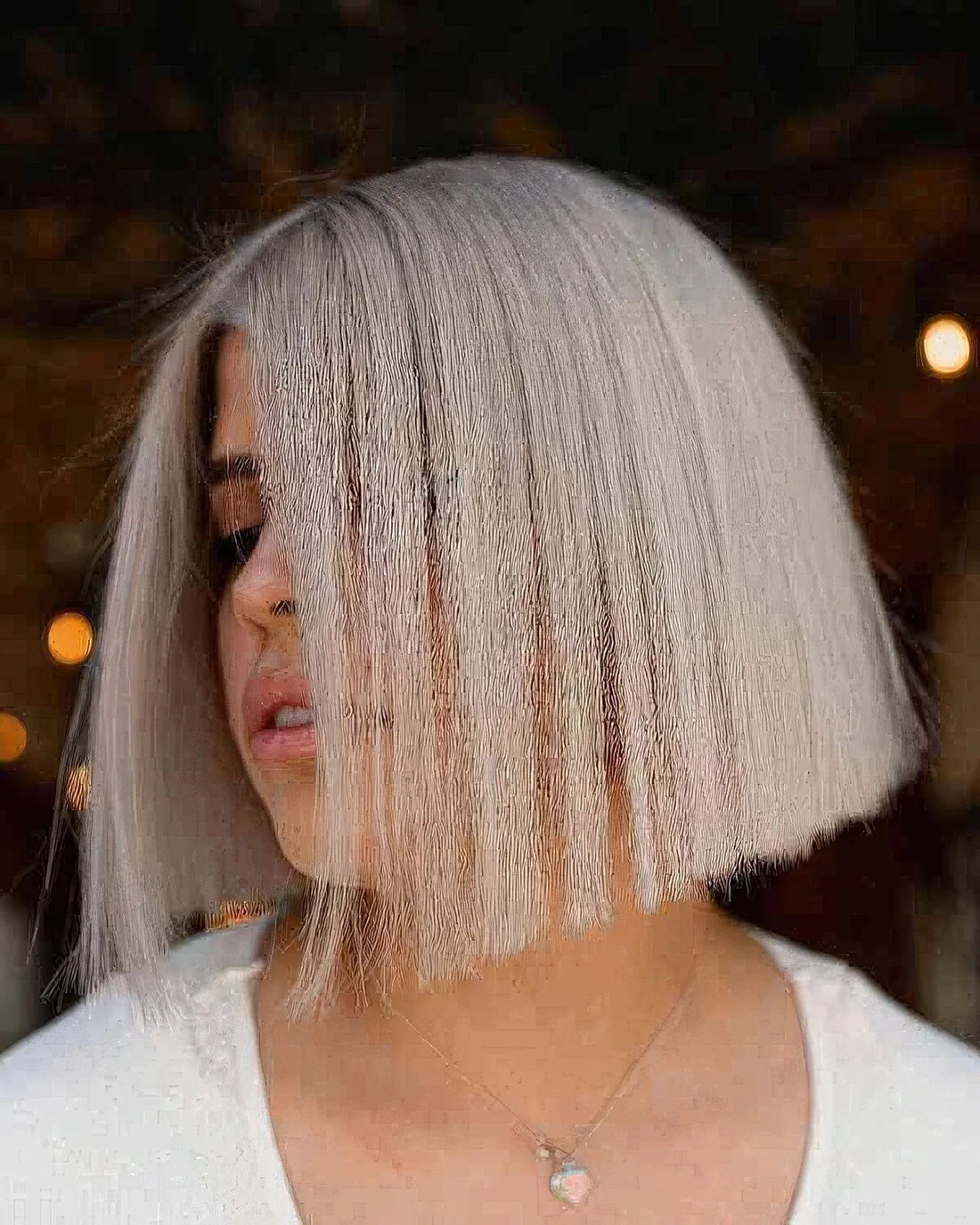 Photo showing platinum blunt blonde bob, with the hairstyle clearly visible.