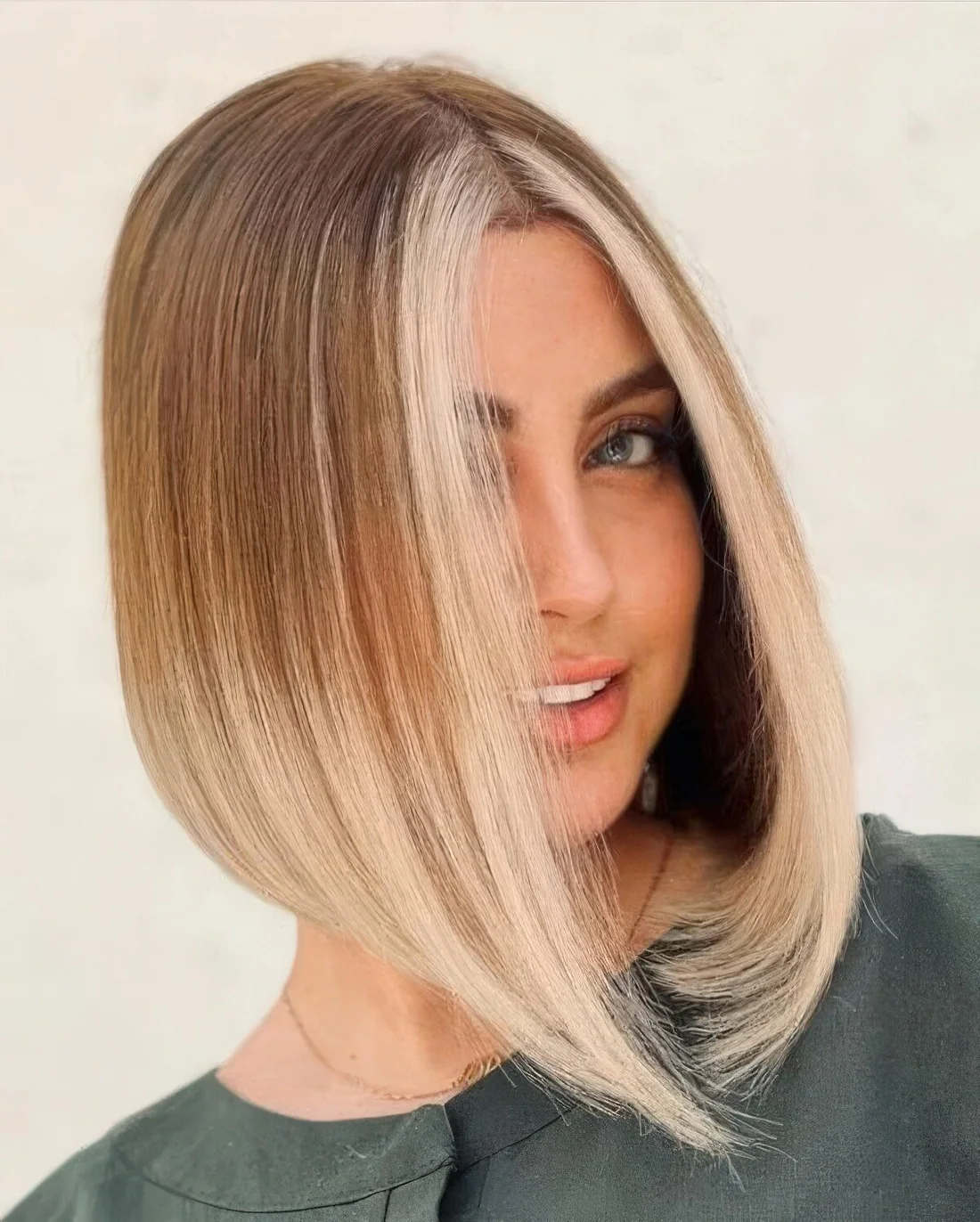 Straightened rounded blunt bob with ombre and a money piece.