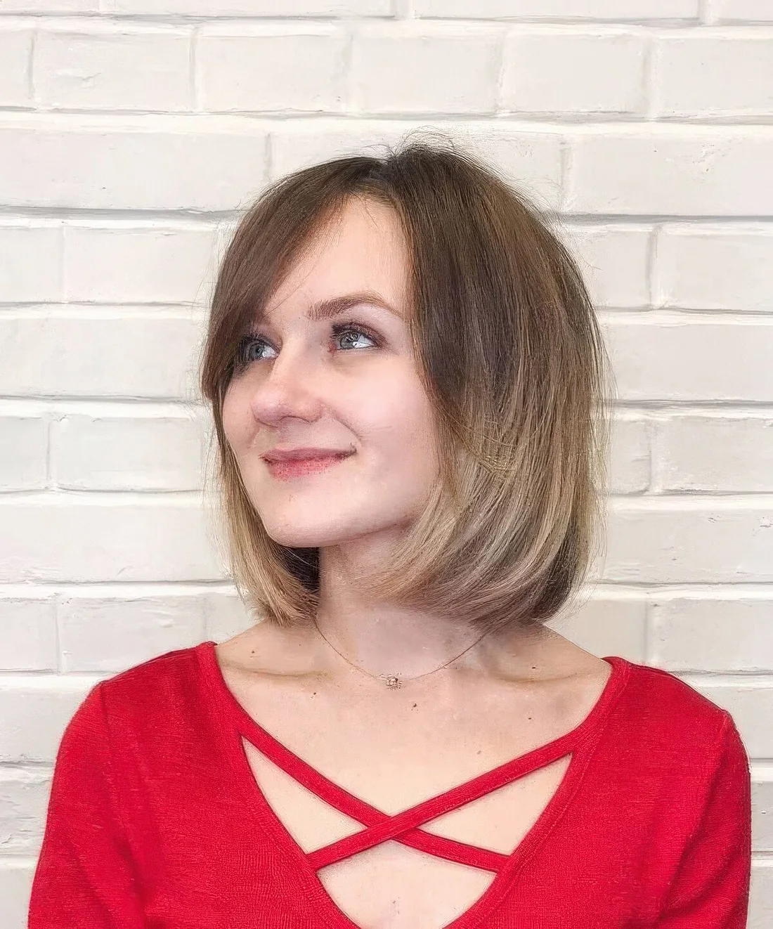 Sassy blunt bob with an ombre effect and side bangs.