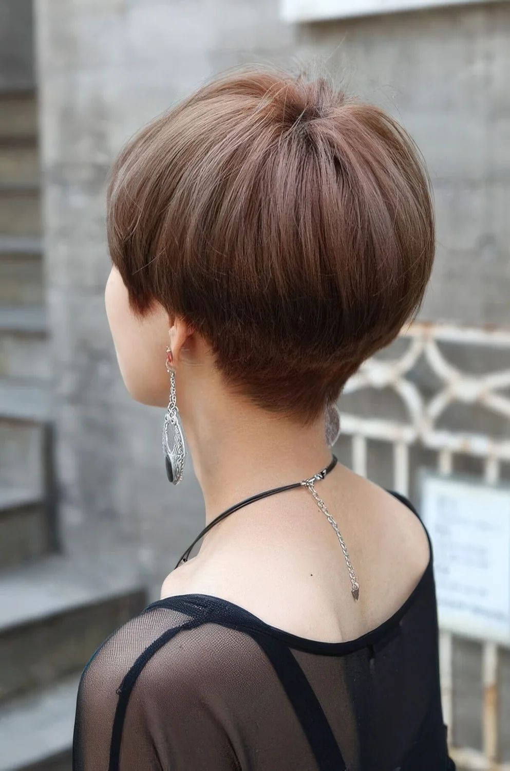 Photo showing chestnut bowl haircut with layers, with the hairstyle clearly visible.