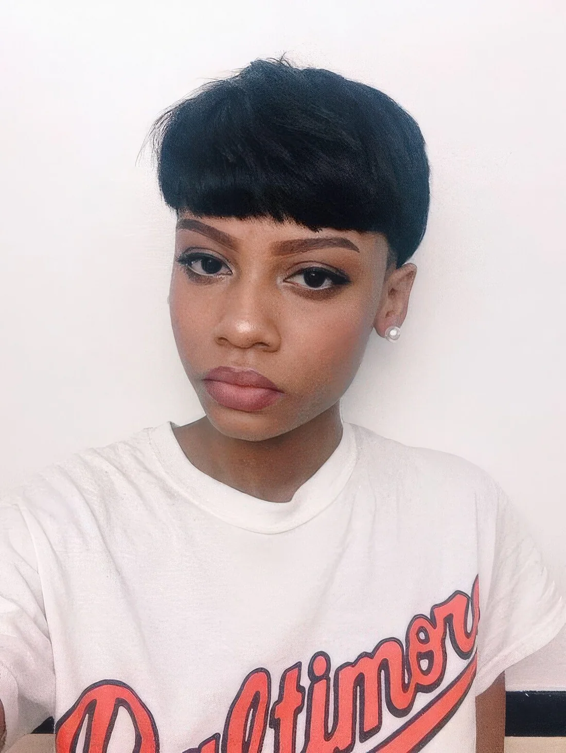 Mushroom haircut done in black with plenty of natural volume and texture.