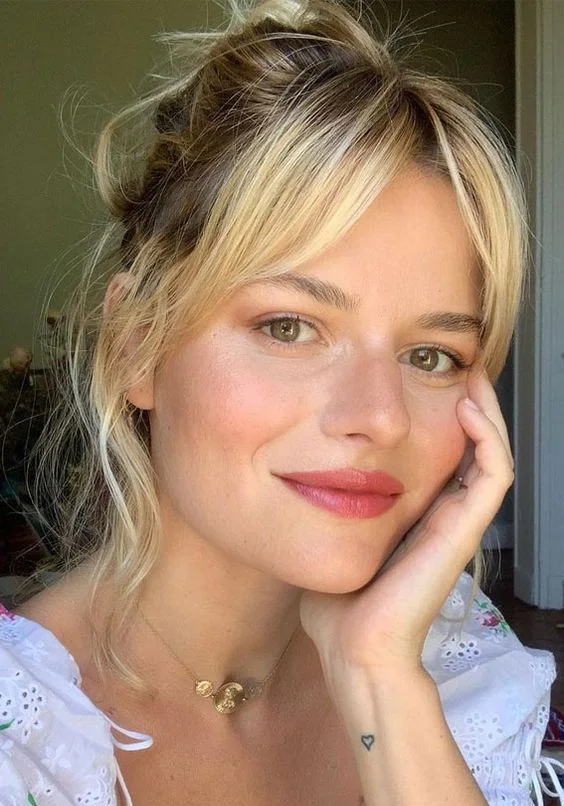 Photo showing messy updo hairstyle, with the hairstyle clearly visible.