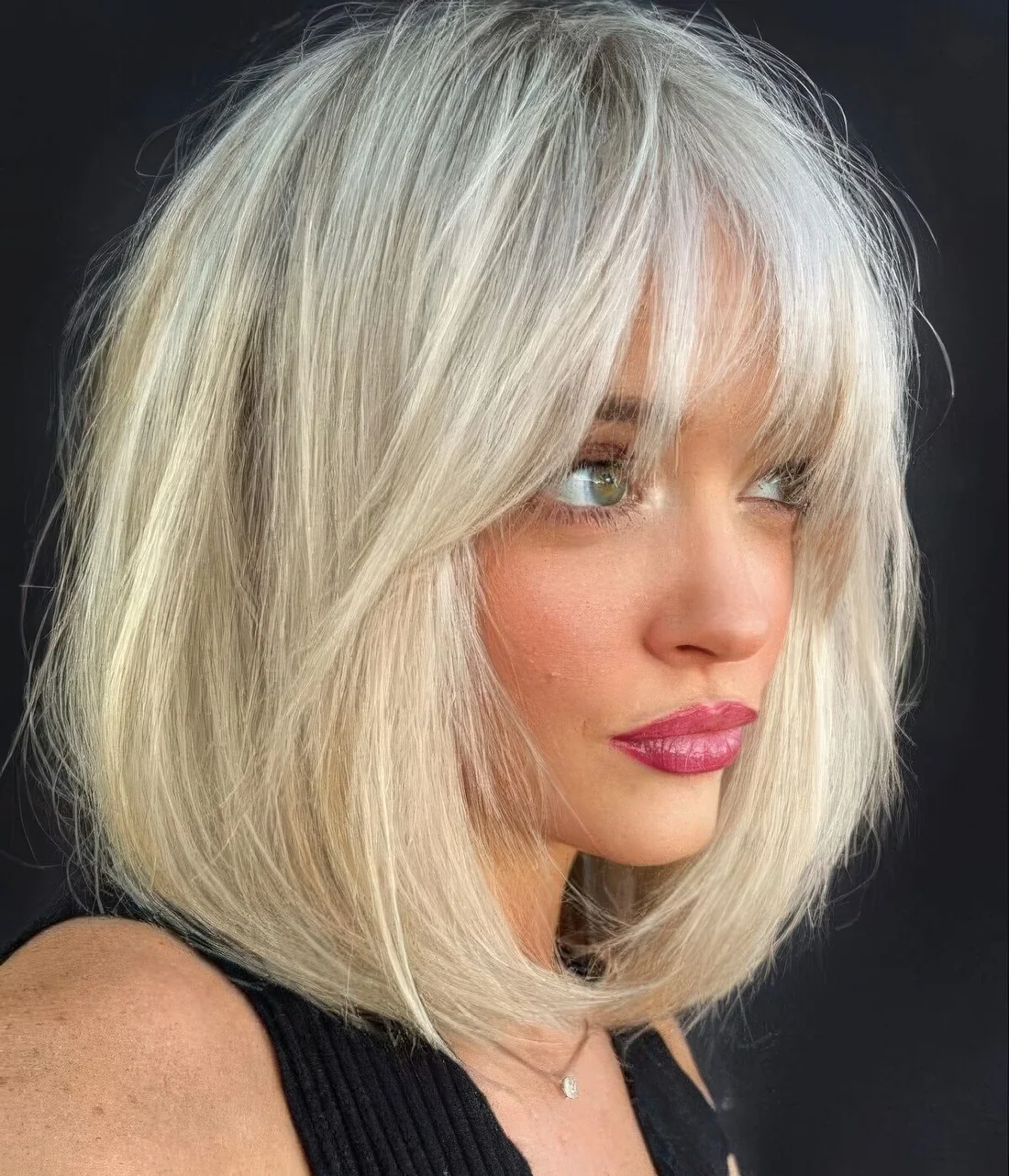 Photo showing piecey bangs and curtain ones, with the hairstyle clearly visible.