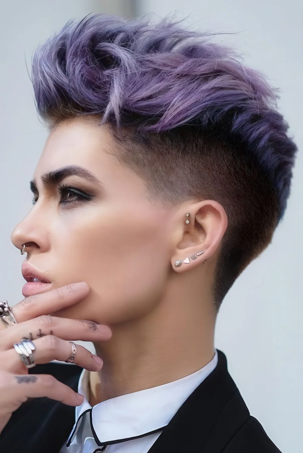 Lilac pixie haircut with much texture.