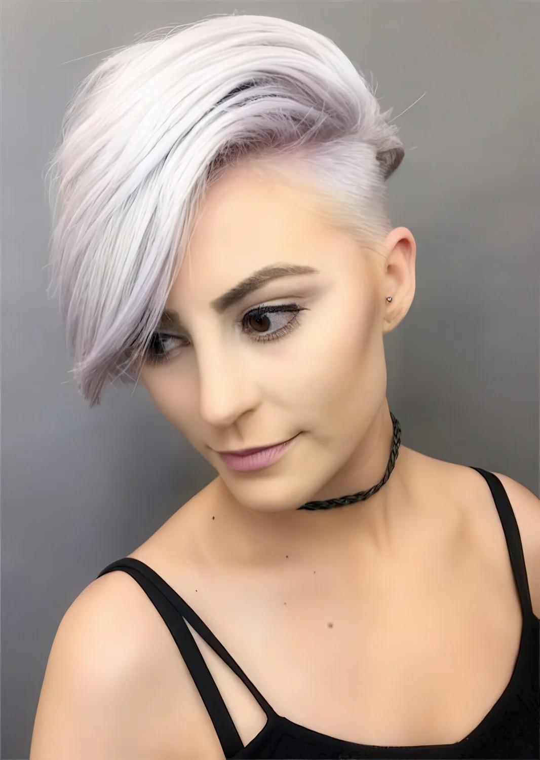 Undercut long pixie hairstyle with a touch of lilac.