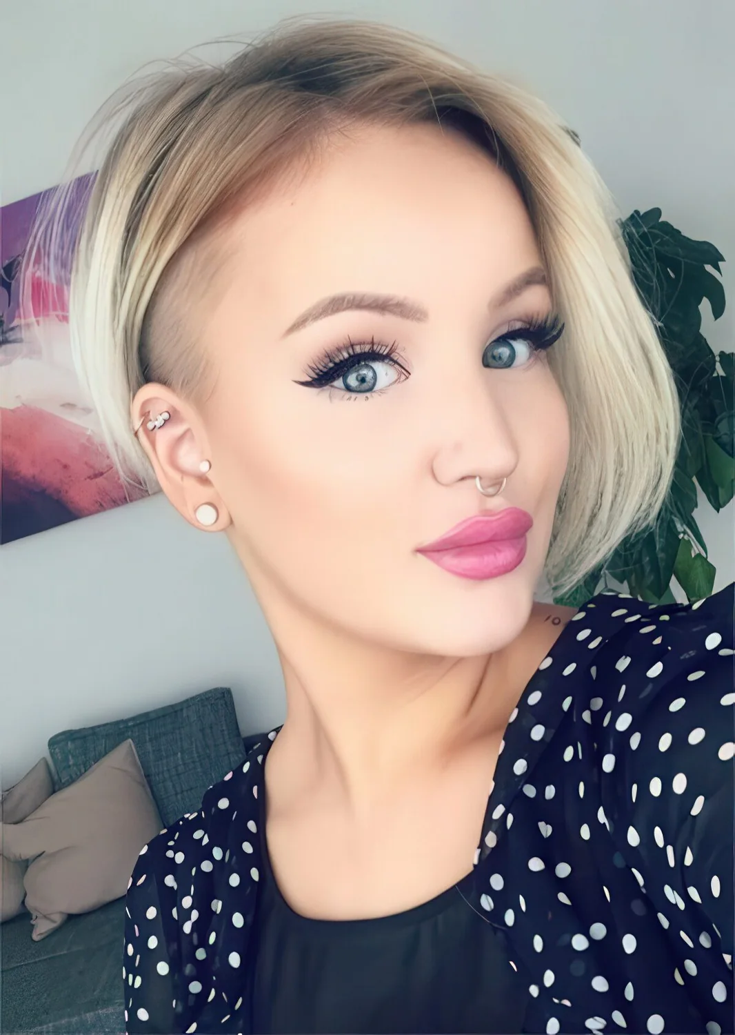 Photo showing asymmetrical bob hairstyle, with the hairstyle clearly visible.