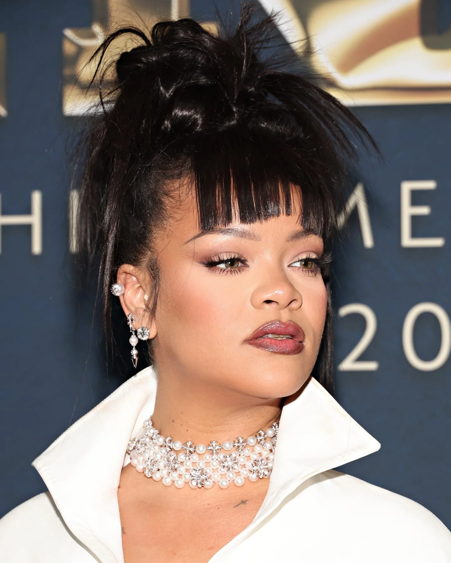 chest straight black updo with wispy fringe shown as a updos for fine thin hair idea