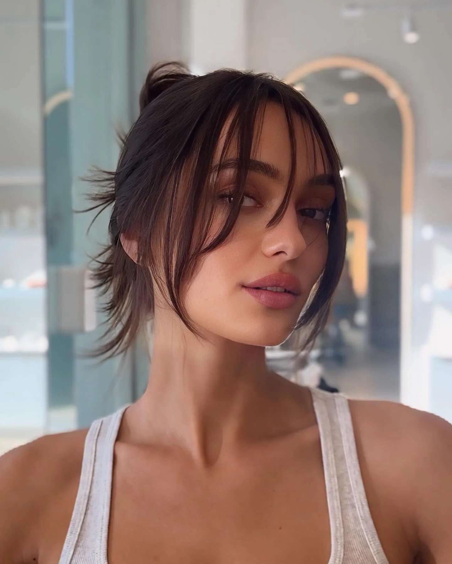 chest wavy chestnut updo with curtain fringe shown as a updos for fine thin hair idea