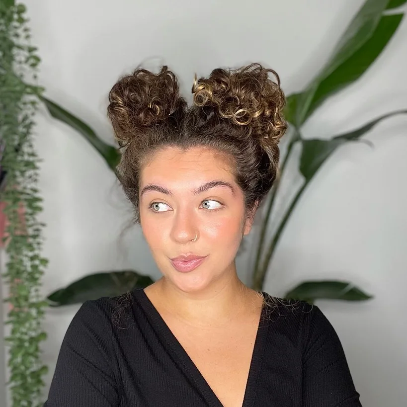 shoulder curly brunette bun shown as a updos for fine thin hair idea