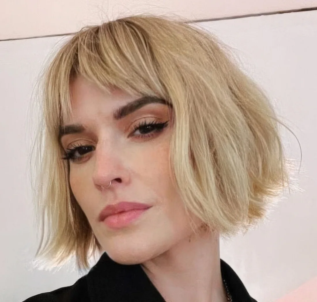 Photo showing blonde cowgirl bob, with the hairstyle clearly visible.