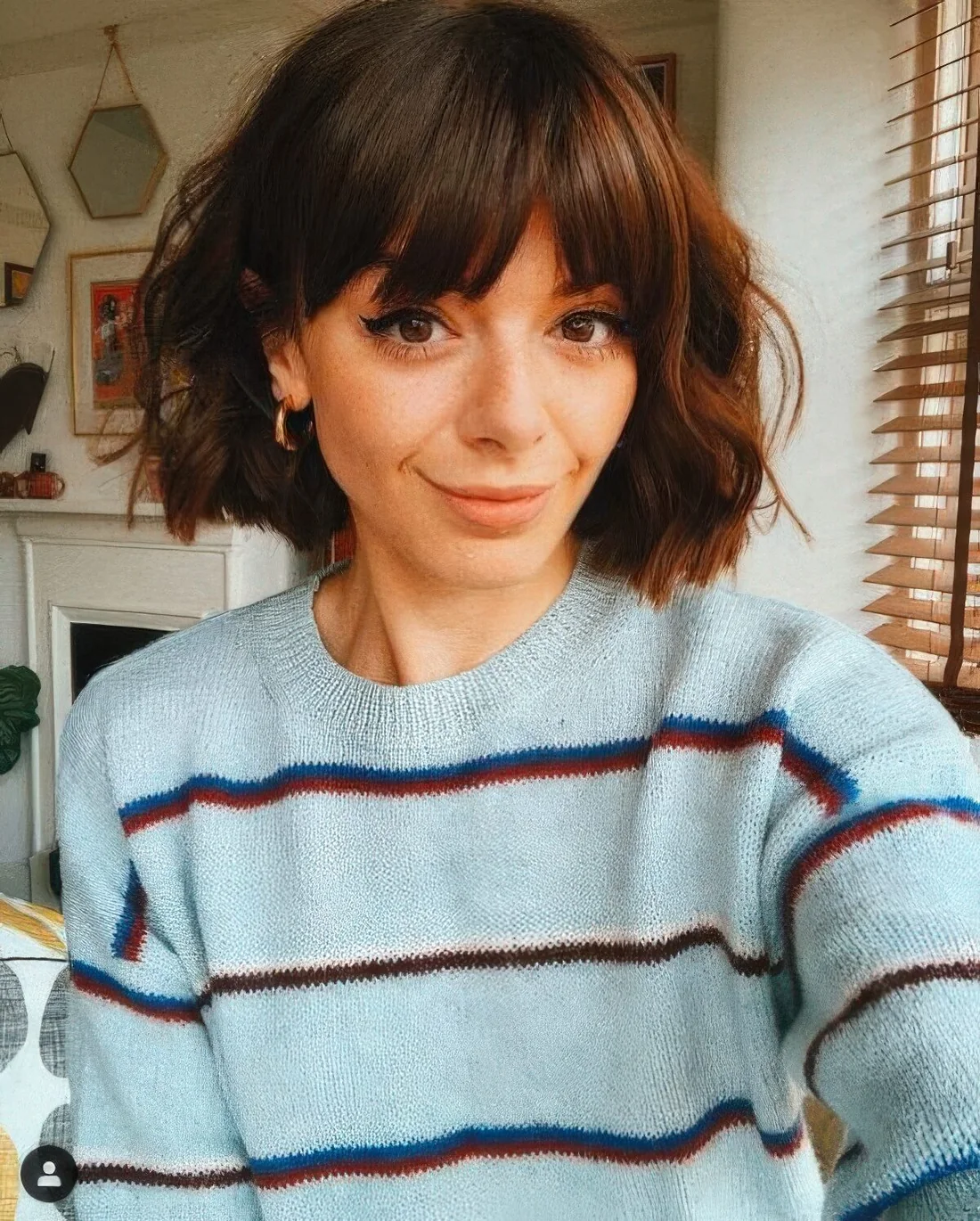 Photo showing cowgirl bob bottleneck bangs, with the hairstyle clearly visible.