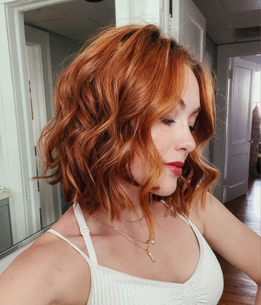 Photo showing ginger bob haircut, with the hairstyle clearly visible.