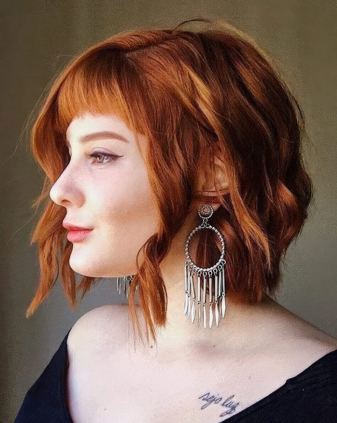 Photo showing ginger cowgirl bob, with the hairstyle clearly visible.