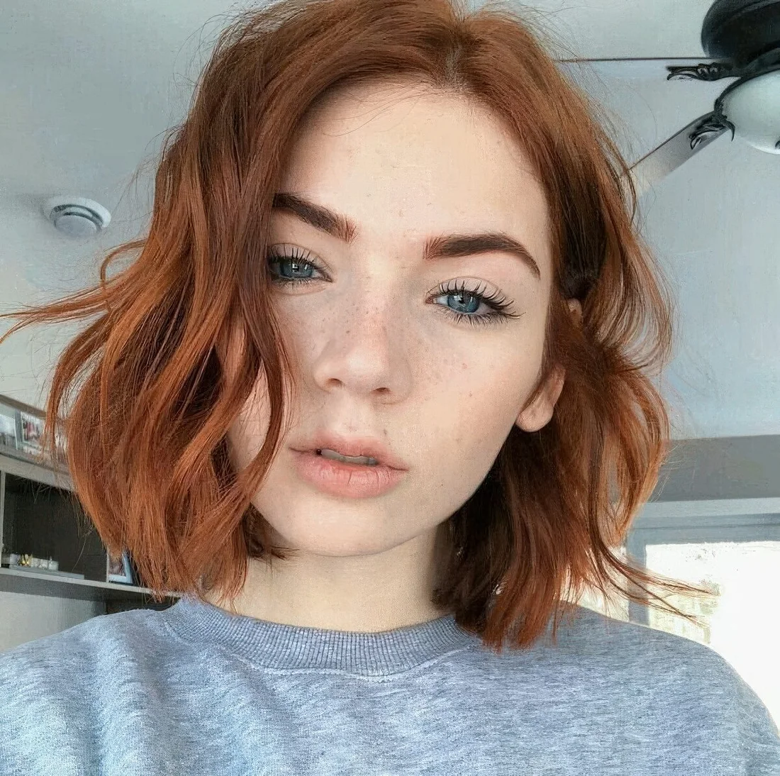 Photo showing messy ginger bob, with the hairstyle clearly visible.