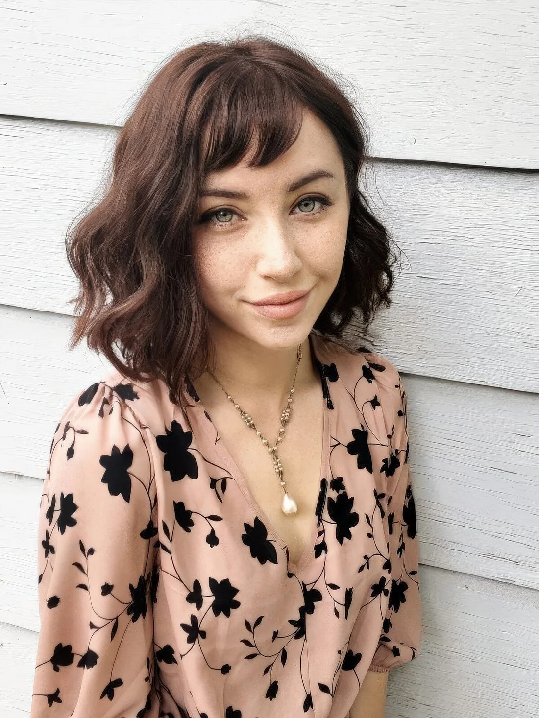 Photo showing messy wavy long bob bangs, with the hairstyle clearly visible.