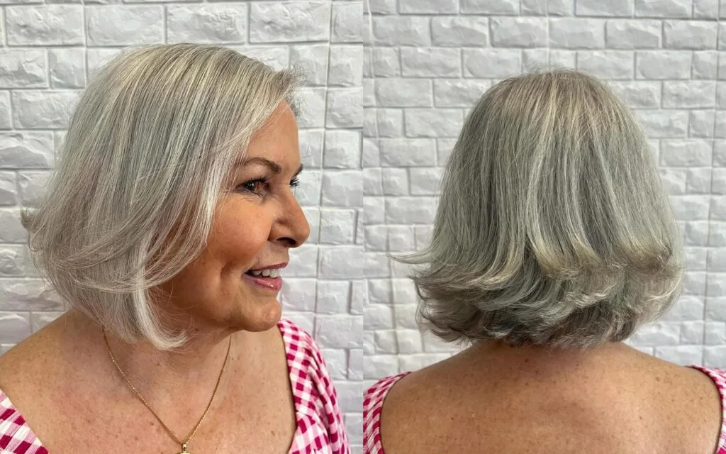 neck wavy silver bob shown as a wash and wear haircuts for women over 60 idea, featuring side part