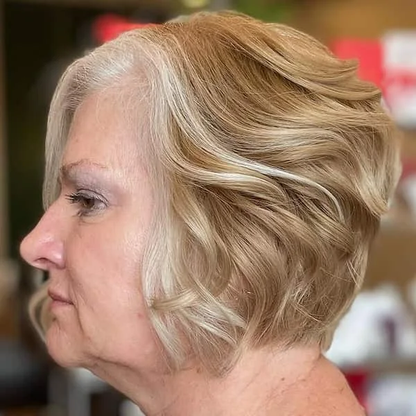ear wavy chestnut bob shown as a wash and wear haircuts for women over 60 idea, featuring volume through the crown