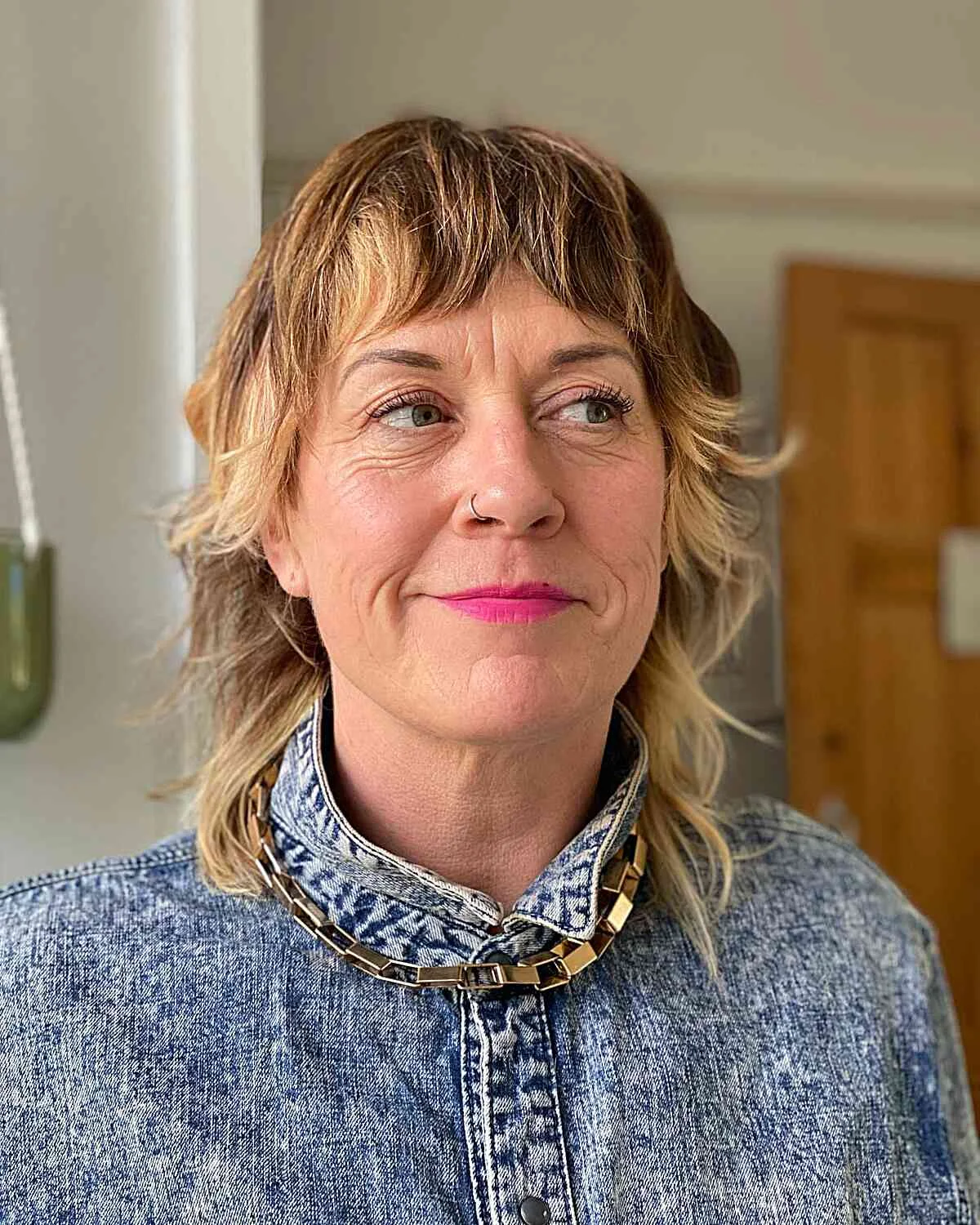 shoulder wavy silver shag with curtain fringe shown as a wash and wear haircuts for women over 60 idea