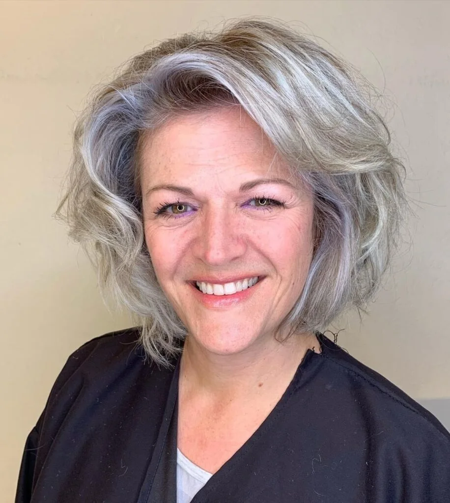 chin wavy silver bob shown as a wash and wear haircuts for women over 60 idea