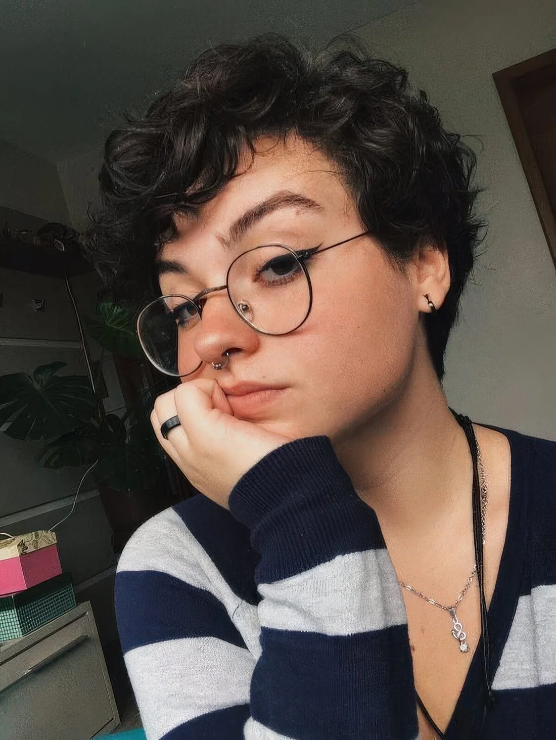 Black wavy bixie with long bangs and enough volume.