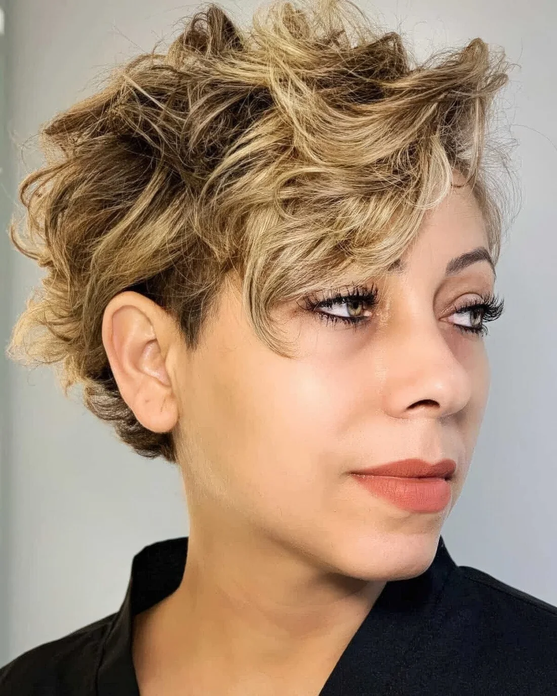 Photo showing long wavy pixie, with the hairstyle clearly visible.