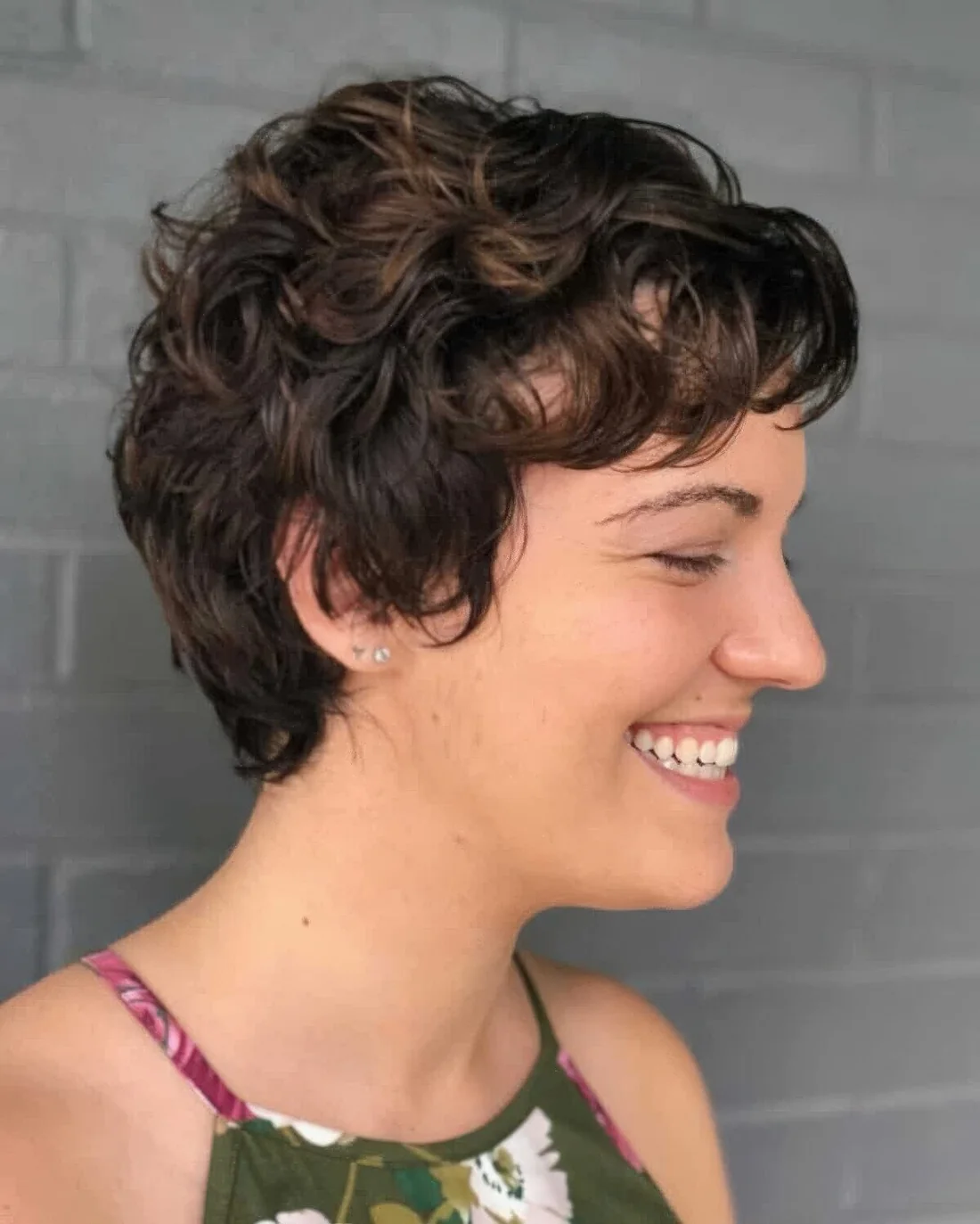 Wavy pixie with softness around the ears.