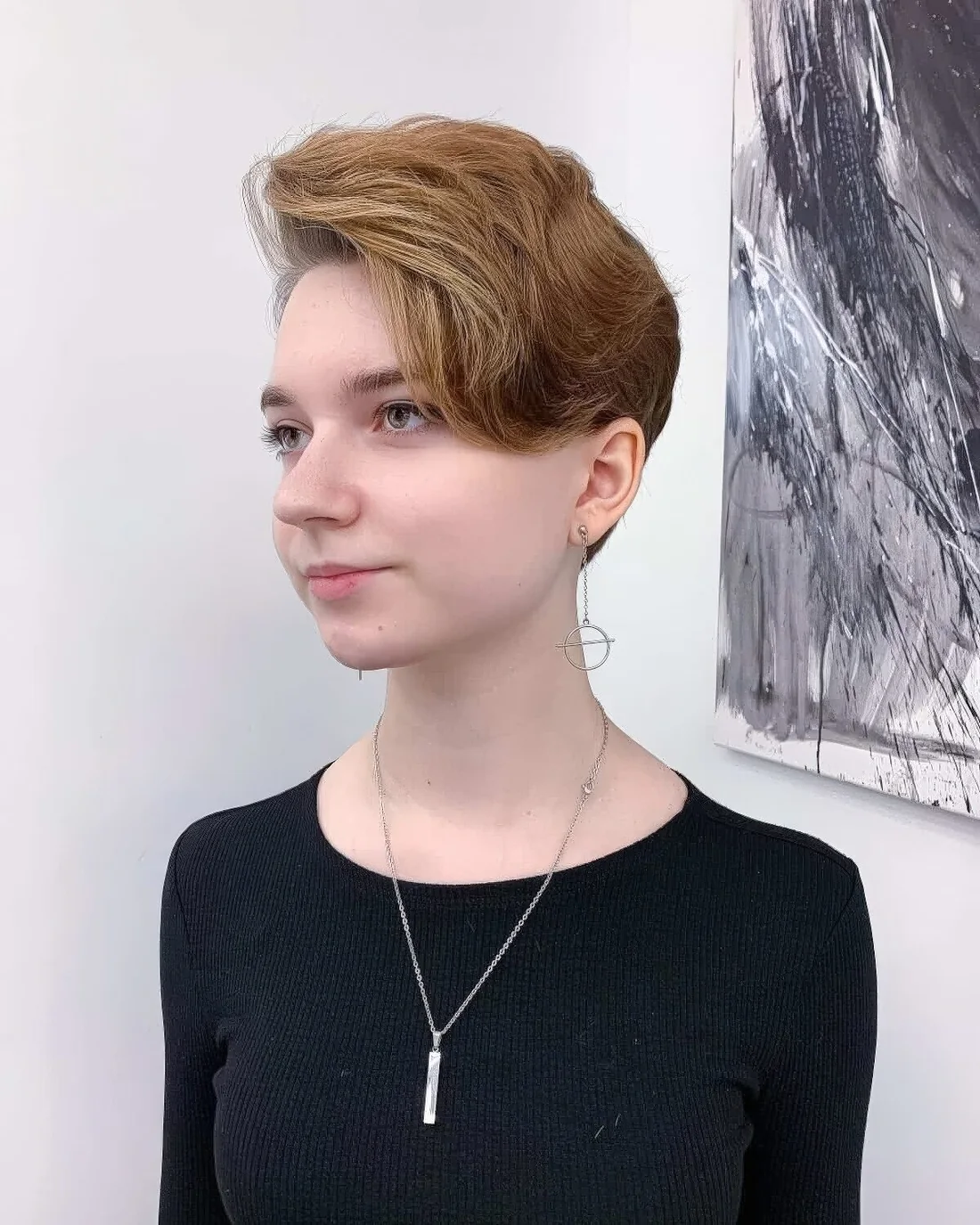 Asymmetrical wavy pixie cut to show off beautiful jawlines and creates a slimming effect to the side of the face.