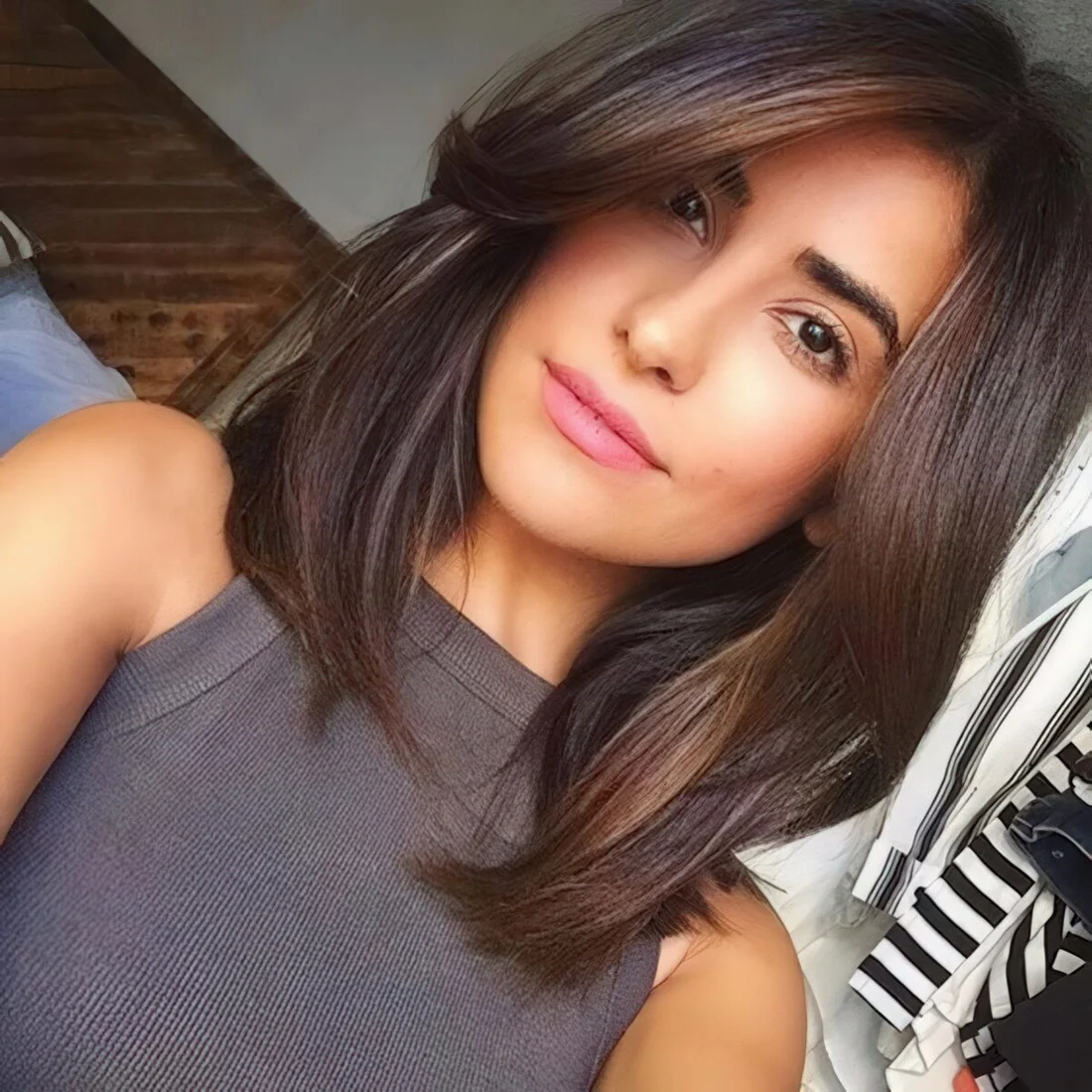 Dark long bob with a side curtain fringe and enough volume.