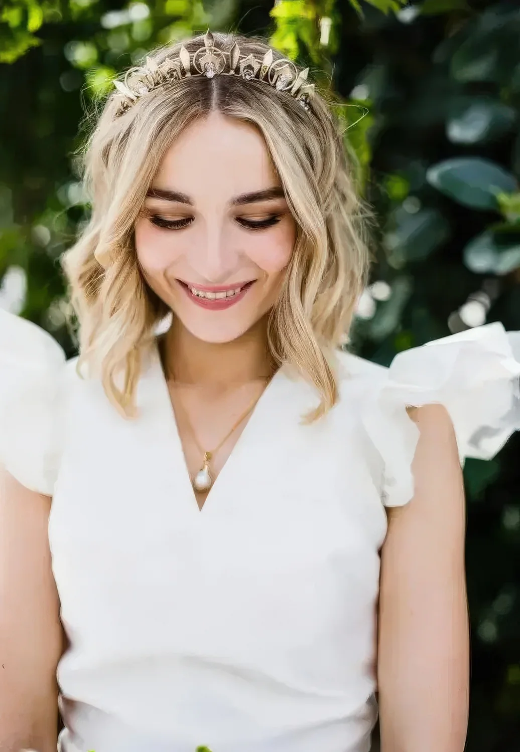 Long blonde bob with a lovely crystal tiara as a bold and statement accessory.