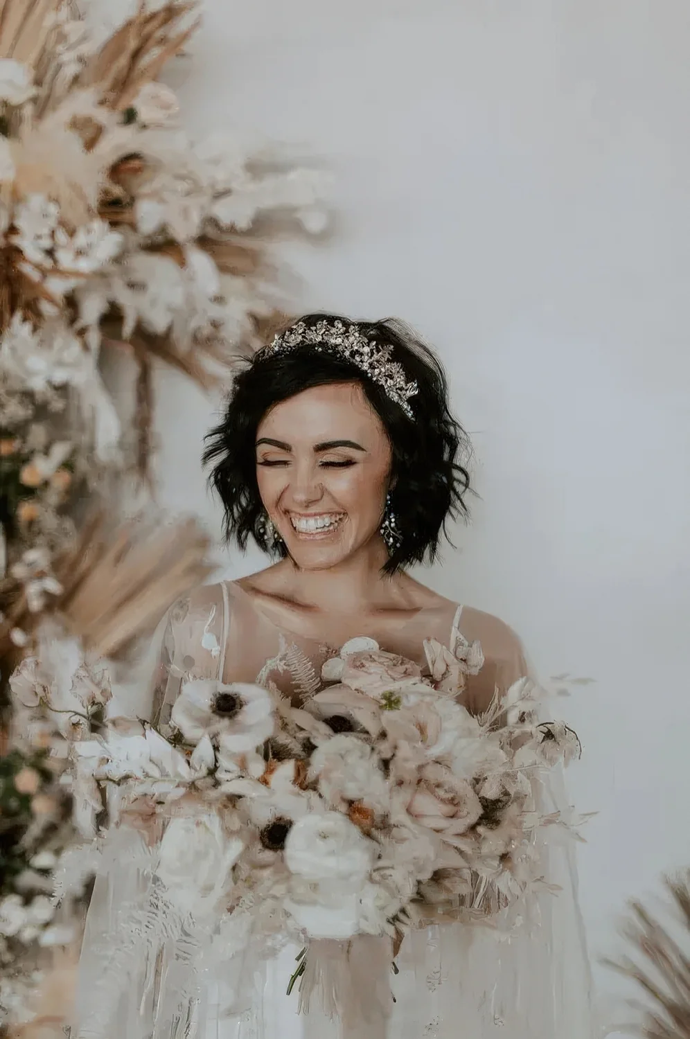 Textured feathered black bob with a gorgeous rhinestone tiara.