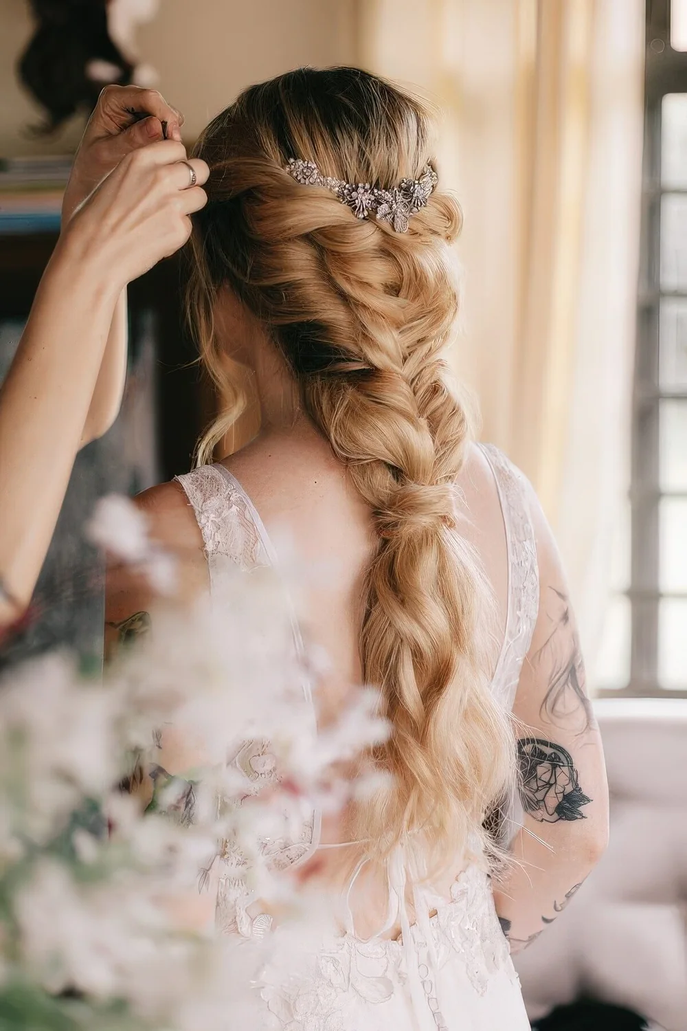 Loose braid into a ponytail with an embellished hair vine.
