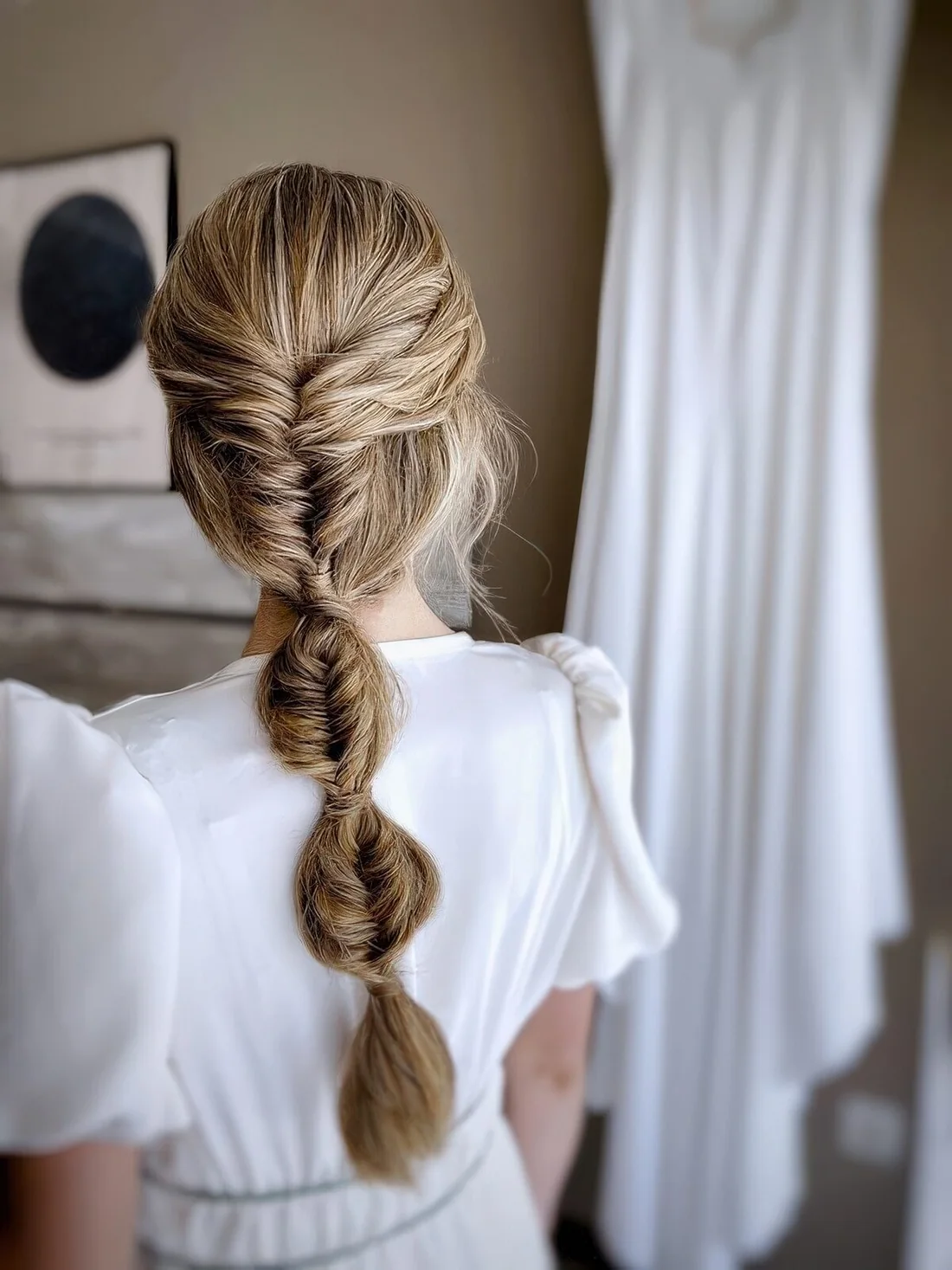 Photo showing tight bubble braid, with the hairstyle clearly visible.