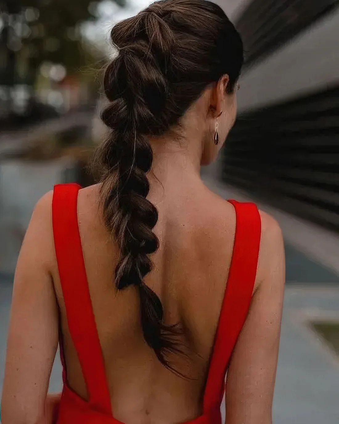 Long loose fishtail braid with a volume on top.