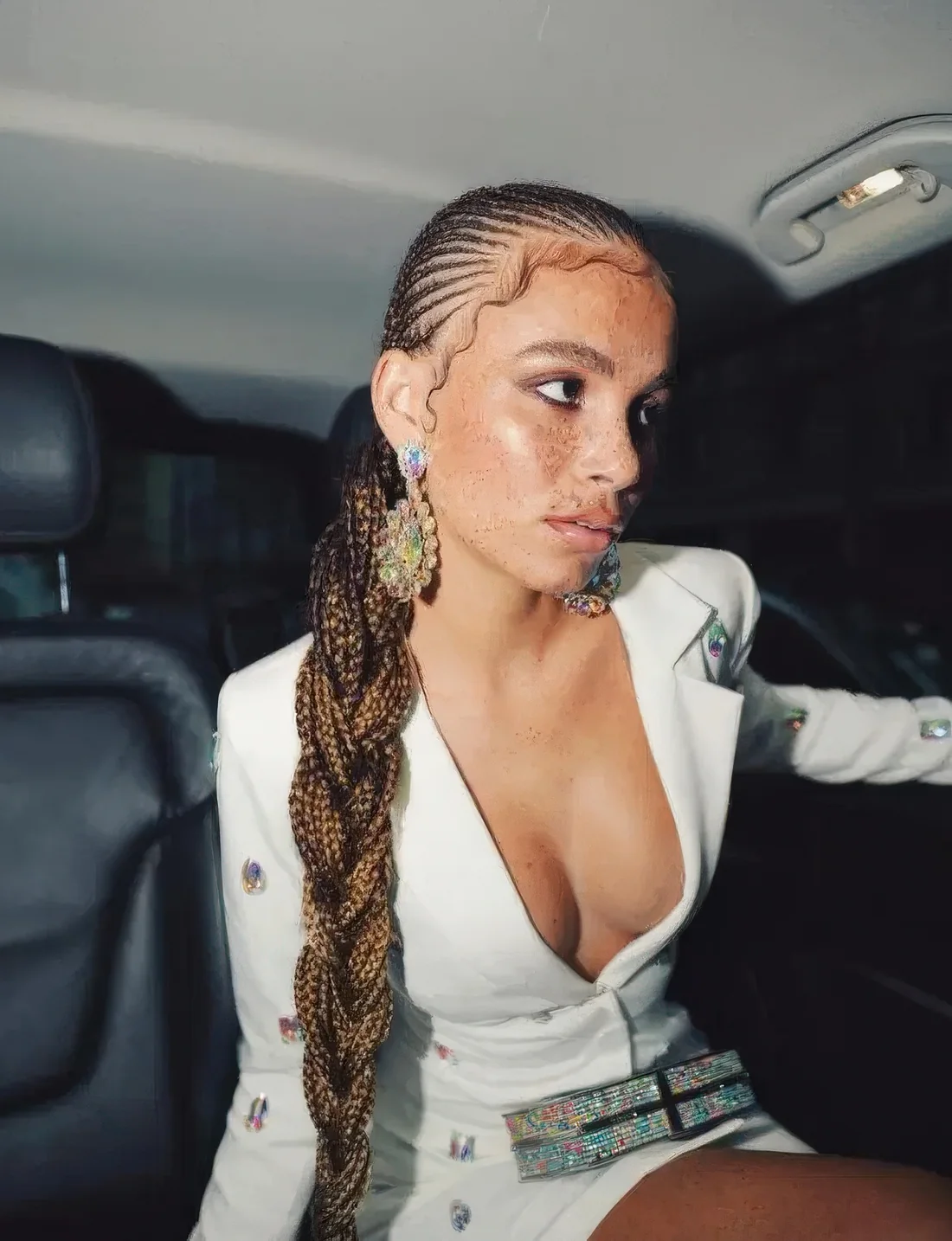 Photo showing long braid of braids, with the hairstyle clearly visible.