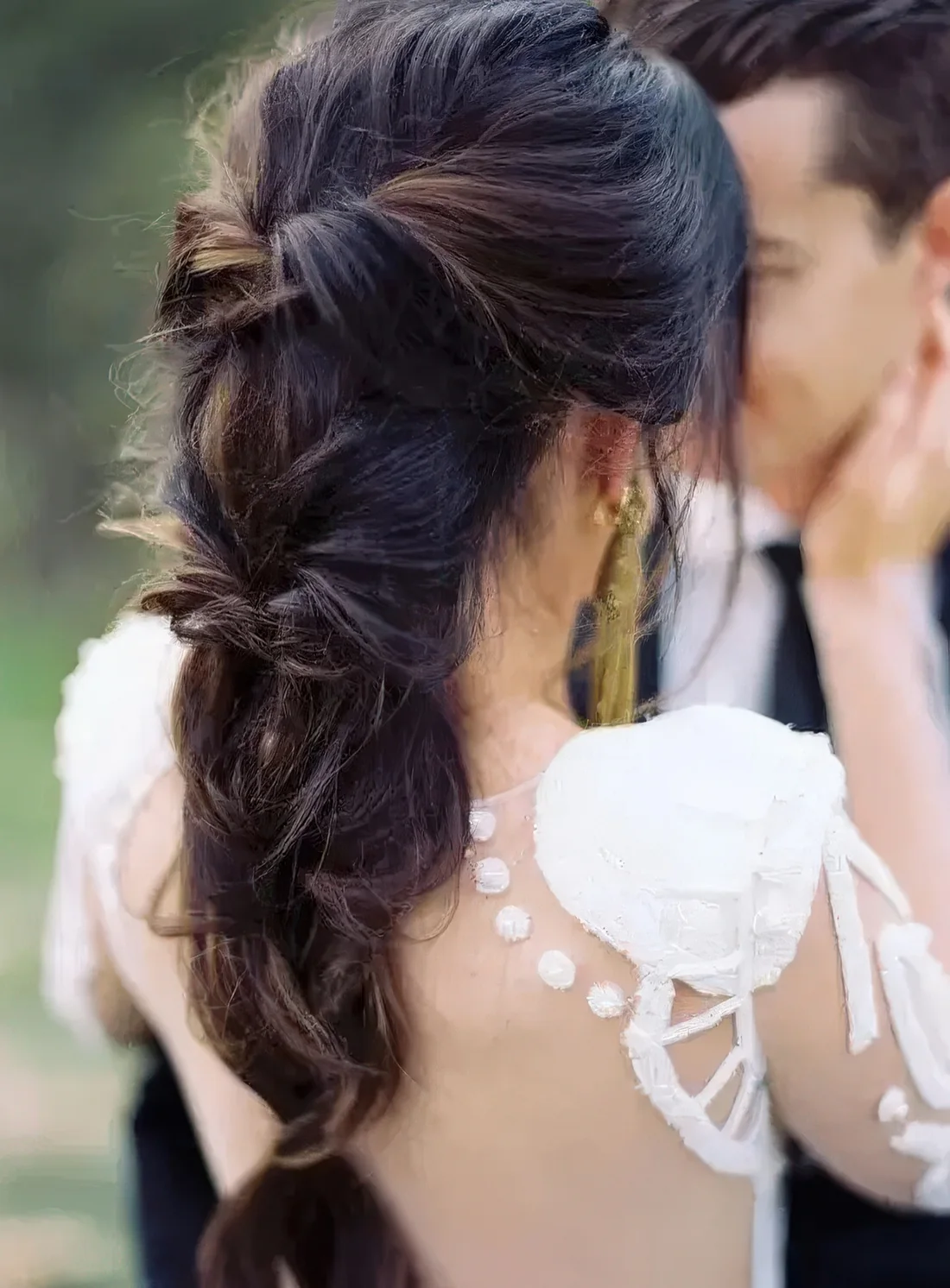 Loose and twsited braid with a volume on top and some locks down.