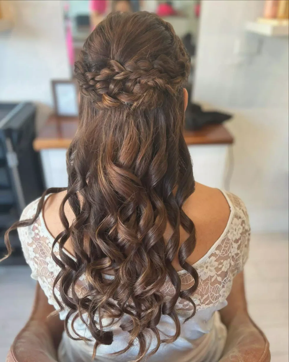 chest wavy blonde braid shown as a wedding hairstyles ideas for long hair idea